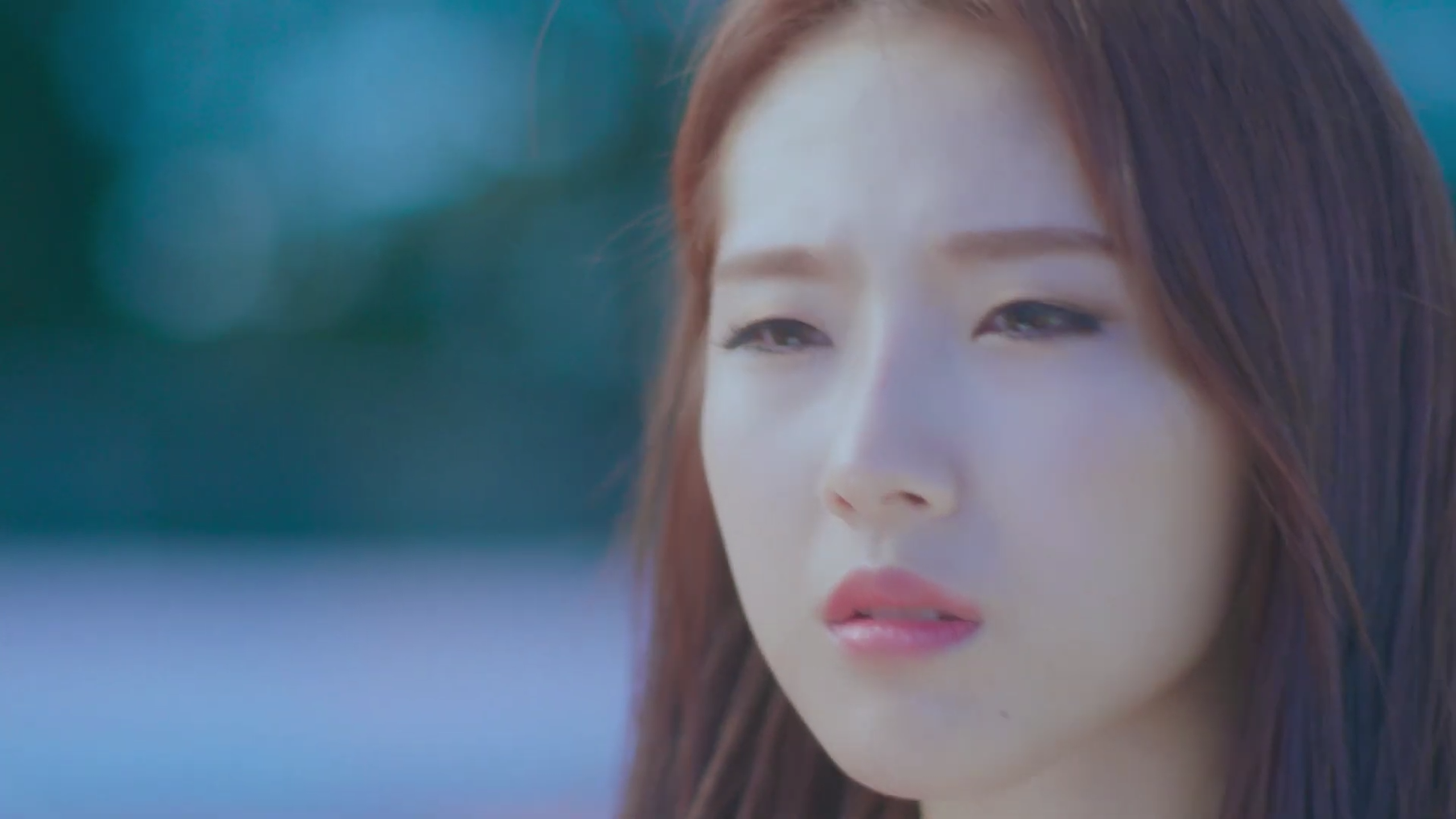 Haseul squinting her eyes and frowning.